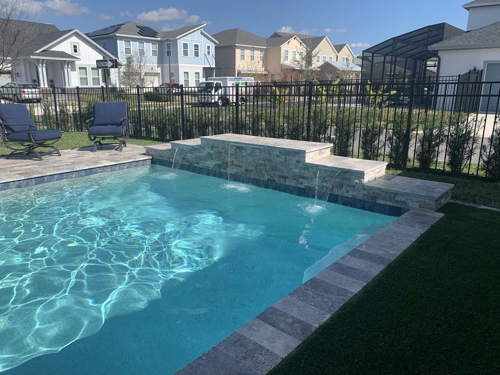 Pool with newly added raised spa and sheet-waterfall spillover