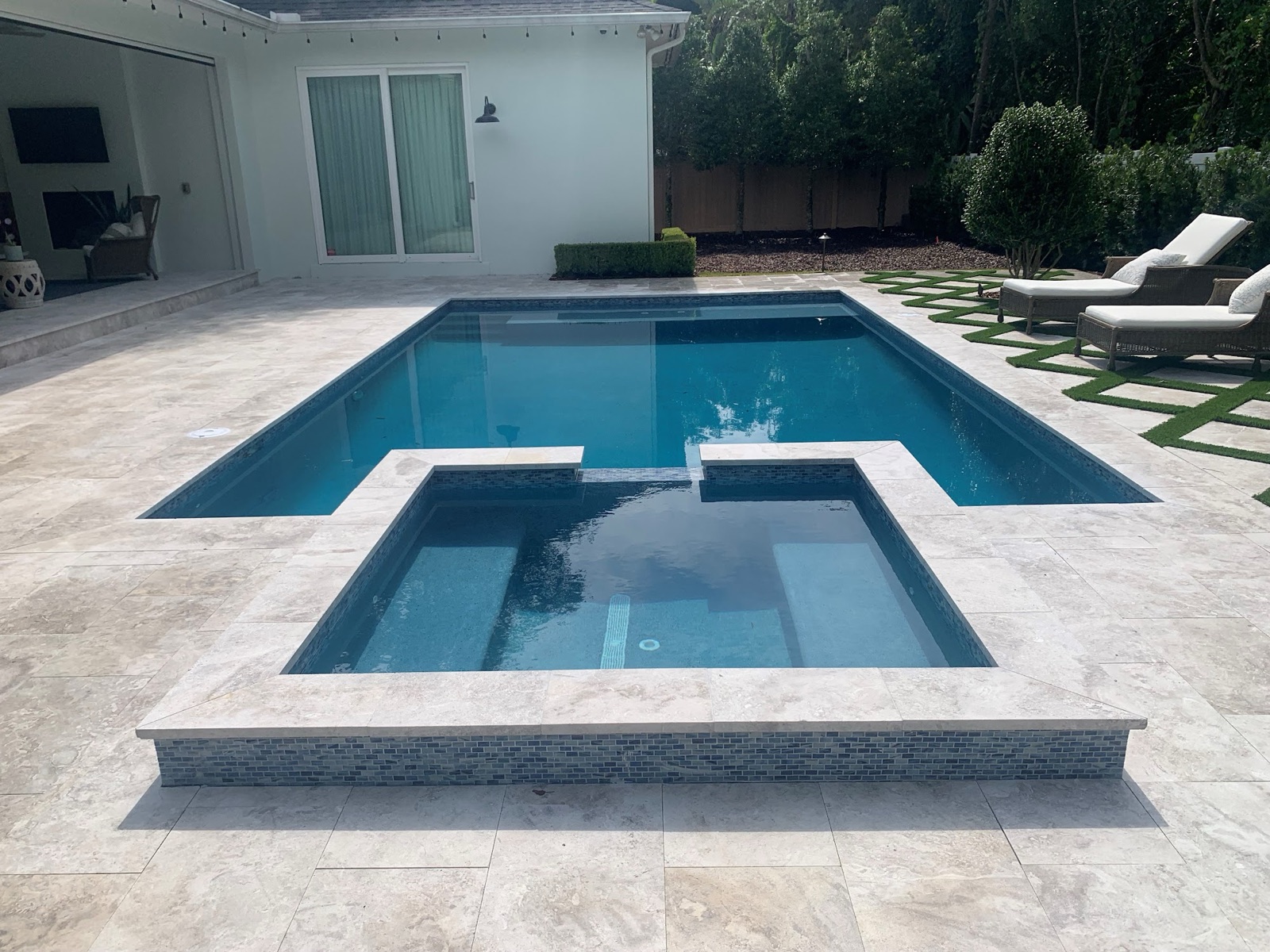 Pool reshaped from freeform to rectilinear with attached spa